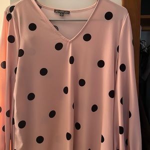 Pink and black polka dot blouse.